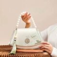 Embroidery_Leather_Vintage_White_Lotus_Handbag_with_Pendant_-_SinoCultural-2476532