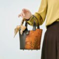 model-arm-carry-plum-blossom-handbag-front