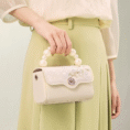 model-holding-orchid-butterfly-bag-front