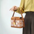 model-holding-zhuang-brocade-bag-single-hand