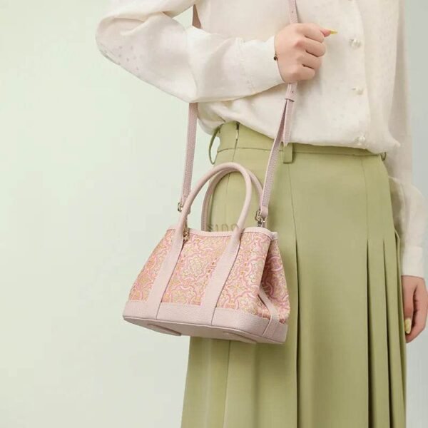 song-brocade-pink-dingsheng-crossbody-bag-model-green-dress-shoulder song-brocade-pink-dingsheng-crossbody-bag-model-green-dress-shoulder