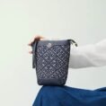 zhuang-brocade-bucket-crossbody-bag-model-blue-dress-sitting-knee